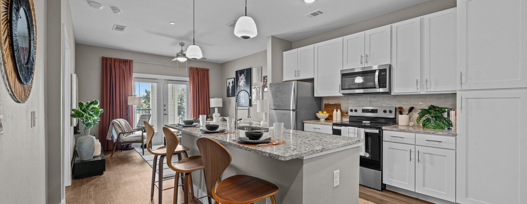 a kitchen with white cabinets