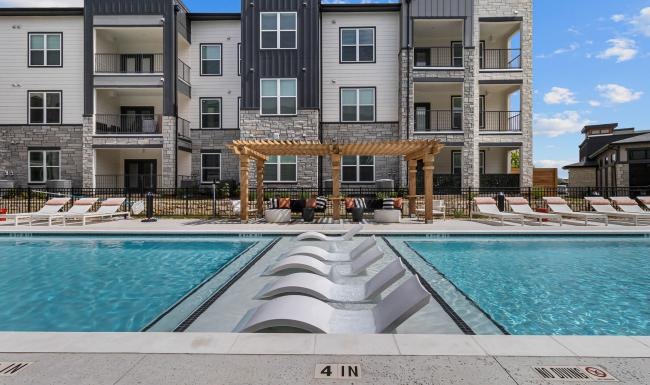 a pool in front of a building